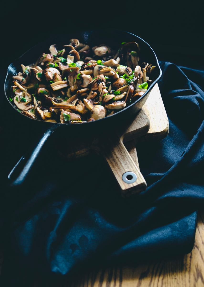 pan with sauteed mushrooms and herbs